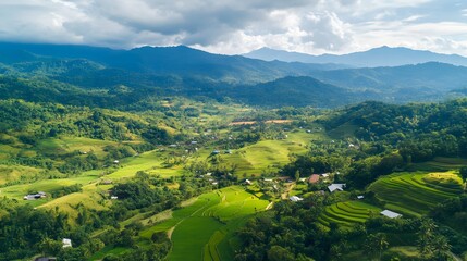 Lush green hills under a cloudy sky, expansive landscape with rolling terrain and vibrant vegetation, great for nature themes.