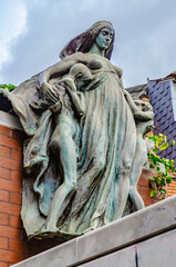Sculpture group near the red brick wall, Liege, Belgium