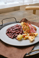 Delicious with roasted fish and red beans, garnished with slices of bacon