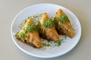Turkish Dessert Sobiyet, havuc dilimi, midye baklava, mussels baklava and classic baklava with Pistachio . Cikoltali cevizli, fistikli soguk Baklava, top view.