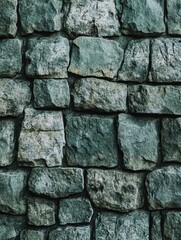 Stunning image of a textured stone wall background, ideal for advertising, design, or any project requiring a rustic, natural aesthetic. The photograph showcases a weathered and aged appearance with