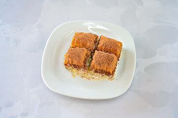 Turkish Dessert Sobiyet, havuc dilimi, midye baklava, mussels baklava and classic baklava with Pistachio . Cikoltali cevizli, fistikli soguk Baklava, top view.
