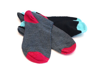 Isolated colorful socks with stripes on white background.