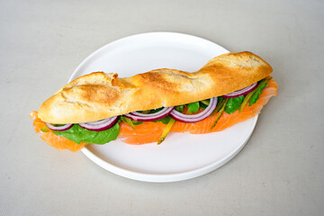 Close-up shot of Izmir's famous Turkish Traditional Kumru Sandwich, Ceşme Kumru, patso ingredients ready to eat salami, soudjouk, tomato, cheddar cheese and fried cheese. Yengen sandvic. Izmir karisik