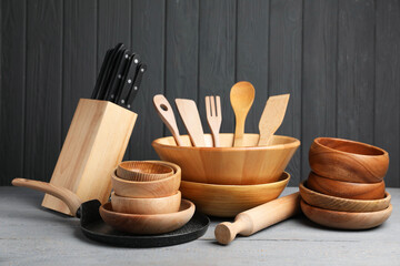 Dishware and cooking utensils on grey wooden table