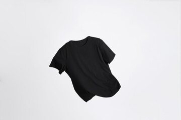 One stylish t-shirt in air on white background