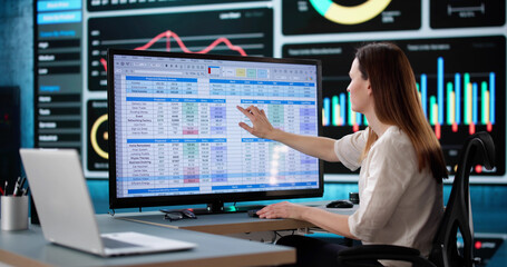 Woman Analyzing Medical Billing Data at Business Office