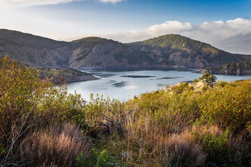 Naklejka premium Cistus ladanifer, Atazar reservoir and Sierra Norte