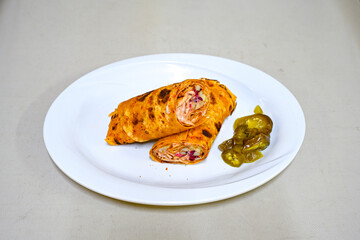 Lavash zurna doner kebab ( zurna  durum )  or shawarma sliced in plate isolated.  hatay usulu tavuk Et doner durum. Gobit ekmek arasi doner. Pilavustu iskender doner kebap. 