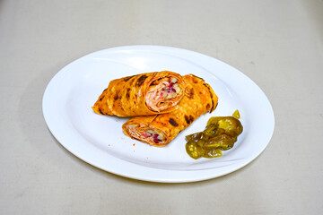 Lavash zurna doner kebab ( zurna  durum )  or shawarma sliced in plate isolated.  hatay usulu tavuk Et doner durum. Gobit ekmek arasi doner. Pilavustu iskender doner kebap. 