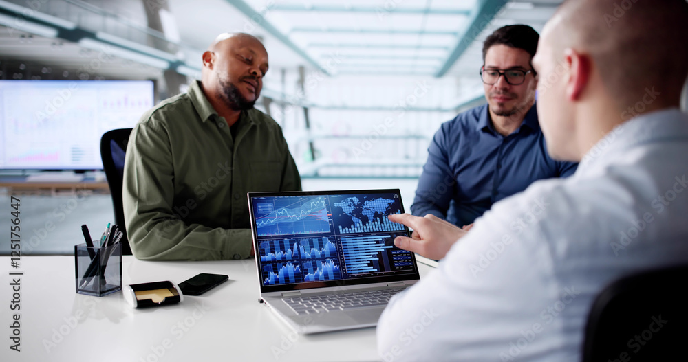 Poster analyzing data for business predictions on diverse group's laptop computer