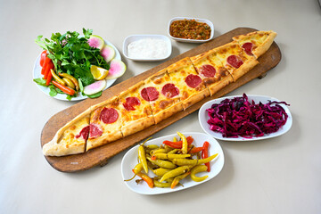 Kiymali pide.Turkish pide with minced meat. Turkish pizza mince pita Pide on white . Etli ekmek.Kusbasi kasarli, kiymali kasarli, kiymali yumurtali, Bafra, Trabzon, Kusbasili pide. Urfa acili lahmacun