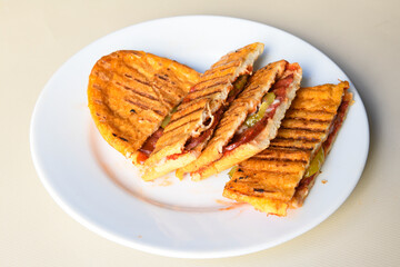 Turkish karisik atom Ayvalik tost ( kasarli bazlama tost) . Sucuklu, Kasarli, kavurmali karisik tost. Flat baked bread toasted. Karisik bazlama tost .  