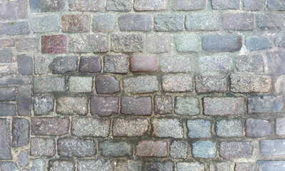 Obraz premium Weathered Cobblestone Wall with Textured Stones, Varied Earthy Tones, and Aged Mortar for Rustic Charm
