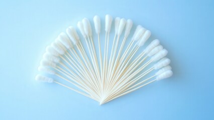 Fanned Arrangement of Cotton Swabs on a Light Blue Background