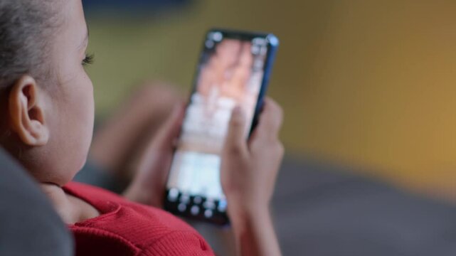 Kids using smart phone scrolling screen