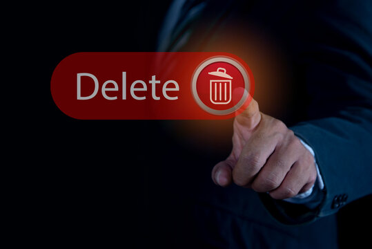 Man pushing the delete button on virtual screen. The concept of deletion or erase contacts, files, informations.