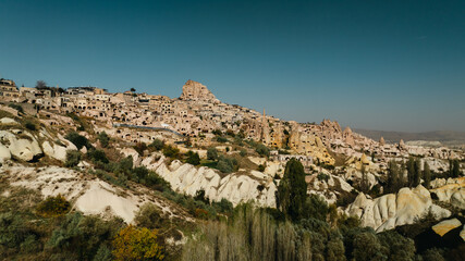 Fototapeta premium The Famous Uchhisar Cave Castle In Cappadocia, At Sunset, Turkey, Aerial View