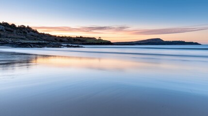 Fototapeta premium Tranquil sunset reflection over serene beach coastal landscape nature photography peaceful environment wide-angle view calmness and serenity