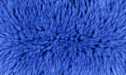 Fototapeta premium Blue animal fur textured background. Faux fur, velors blue fabric or cloth. Fluffy fabric texture of artificial fur textile material. Decorative fabric for curtain, furniture, upholstery, walls.