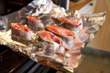 top view of salmon steaks on a wooden board