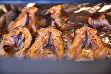 grilled salmon steaks lying on a tray in the oven close-up