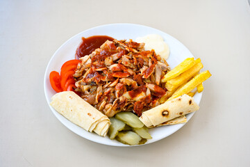 Lavash zurna doner kebab ( zurna  durum )  or shawarma sliced in plate isolated.  hatay usulu tavuk Et doner durum. Gobit ekmek arasi doner. Pilavustu iskender doner kebap. 