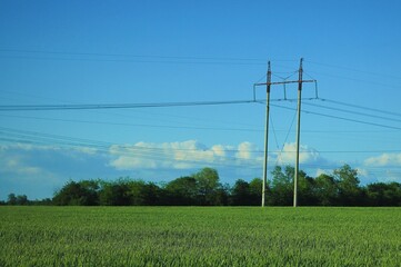 high voltage power lines on field