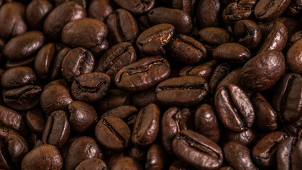 Close-up of roasted coffee beans with a rich, dark texture, ideal for food, beverage, or coffee-related projects.