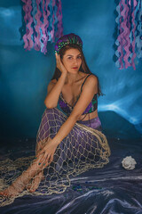 The beautiful mermaid in purple seashells crown closeup