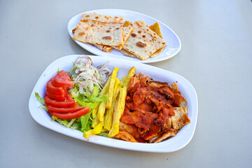 Lavash zurna doner kebab ( zurna  durum )  or shawarma sliced in plate isolated.  hatay usulu tavuk...