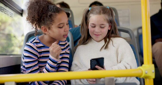 Phone, playing and children on bus for travel together with educational game online for learning. Happy, cellphone and girl students commute with public transport to school looking at class schedule.
