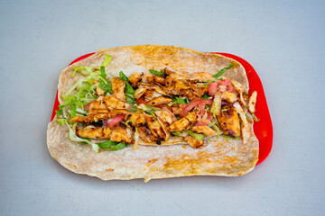 Lavash zurna doner kebab ( zurna  durum )  or shawarma sliced in plate isolated.  hatay usulu tavuk Et doner durum. Gobit ekmek arasi doner. Pilavustu iskender doner kebap. 