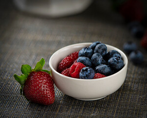 Fresh Mixed Berries in a White Bowl with Strawberries, Raspberries, and Blueberries