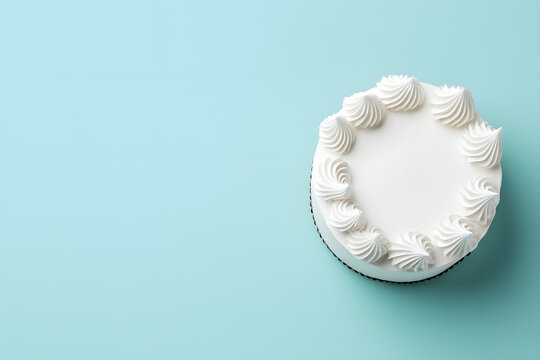 Round white birthday cake mock up, top view isolated on light pastel background