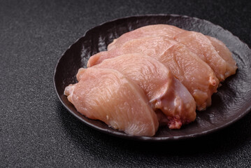 Raw chicken or turkey fillet cut into slices with salt, spices and herbs