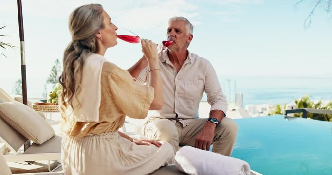 Couple, drinks or toast by swimming pool on holiday, vacation or celebrate love on valentines day date. Cocktail, senior man and woman cheers at resort outdoor for peace, happy or relax in retirement