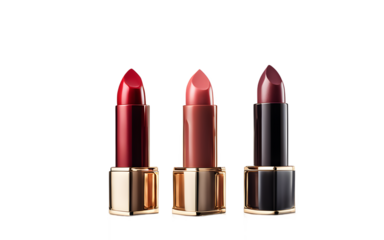 A set of three lipsticks in different shades standing upright on a white empty plain background