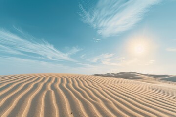 Naklejka premium Rippled Sand Dunes Under a Sunny Blue Sky
