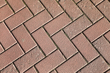 Texture of pink paved road as background