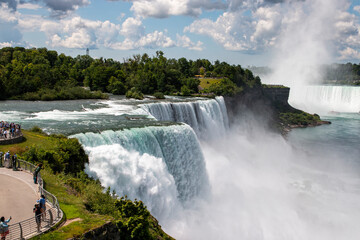 American Falls Waterfall Cascades at Niagara Falls With Visitors Enjoying the Stunning View