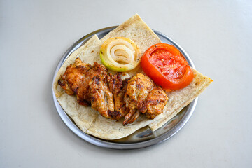 Chicken wings barbeque in a dish with BBQ grill sauce . Izgara tavuk kelebek sis kanat. Izgara tavuk sis, gogus.