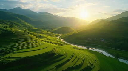 Sun setting over vibrant green rice terraces in Mu Cang Chai, Vietnam