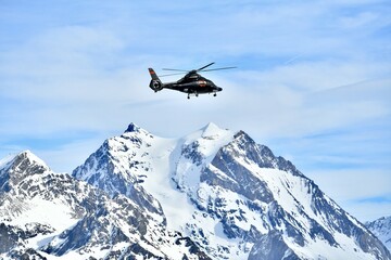 Private helicopter carrying skier tourist to Courchevel ski resort from Geneva airport, Courchevel ski resort airport, Rhône alps, French alps on 02/07/2025 © raeva