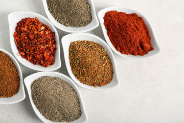 Bowls with different fresh spices on white background