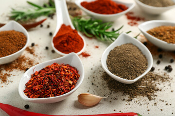 Composition with bowls of different fresh spices on light background