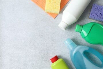 Many different house cleaning products on gray background, top view