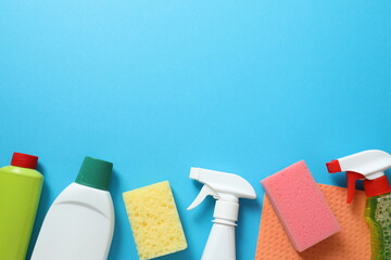 Many different house cleaning products on color background, top view