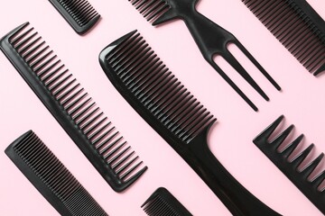 Professional combs and hairdresser tools on color background, top view