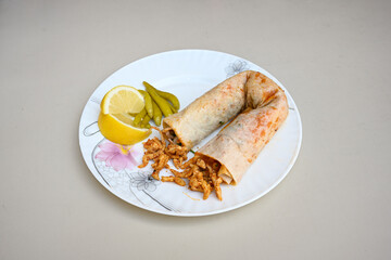 Meat, chicken shawarma kebab with yogurt and fried butter sauce .Tantuni Special. durum  Yogurtlu tantuni. Ekmek arasi tantuni. 